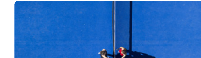 Overhead view of a padel court with players